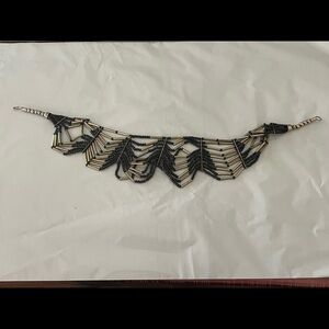 Artisan necklace black beads, silver tubular shapes, larger silver beads m